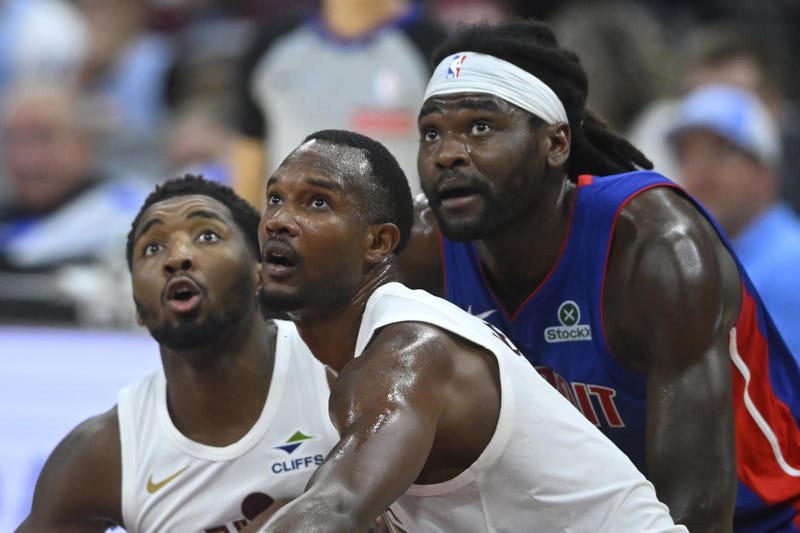 Oct 14, 2025; Cleveland, Ohio, USA; Cleveland Cavaliers guard Donovan Mitchell (45), center Evan Mobley (4) and Detroit Pistons forward Isaiah Stewart (28) look to rebound in the second quarter at Rocket Arena. 