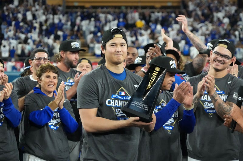 Oct 17, 2025; Los Angeles, California, USA; Los Angeles Dodgers two-way player Shohei Ohtani (17) holds the NLCS most valuable player trophy after game four of the NLCS round for the 2025 MLB playoffs against the Milwaukee Brewers at Dodger Stadium. 