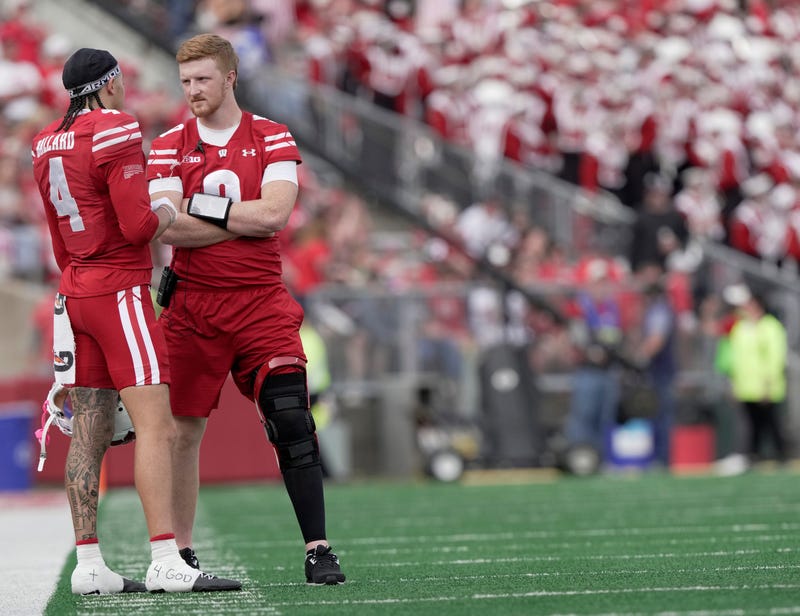 Injured Wisconsin quarterback Billy Edwards Jr. (9) talks with wide receiver Jayden Ballard (4) during the second quarter of their game against Ohio State Saturday, October 18, 2025 at Camp Randall Stadium in Madison, Wisconsin.