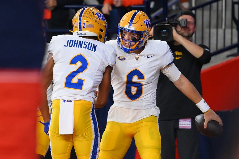 Mason Heintschel celebrating with Kenny Johnson