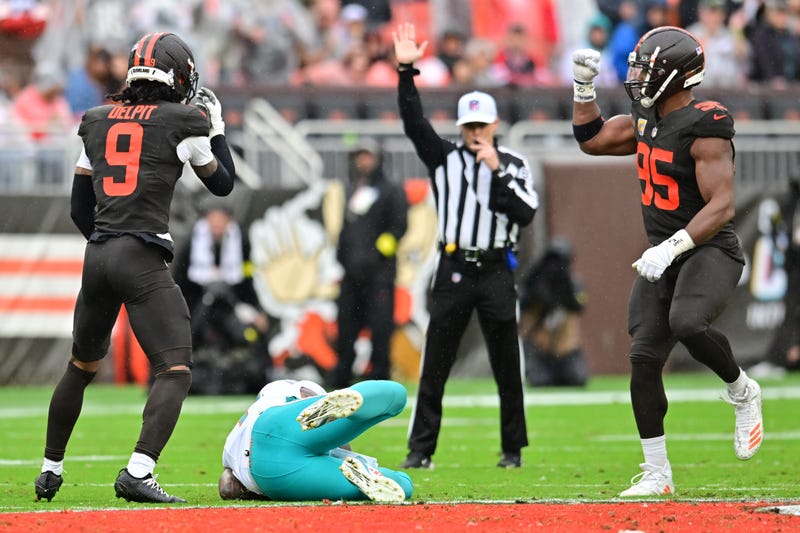  Browns safety Grant Delpit (9) and defensive end Myles Garrett (95) celebrates after Delpit sacked Miami Dolphins quarterback Tua Tagovailoa (1) during the first half at Huntington Bank Field