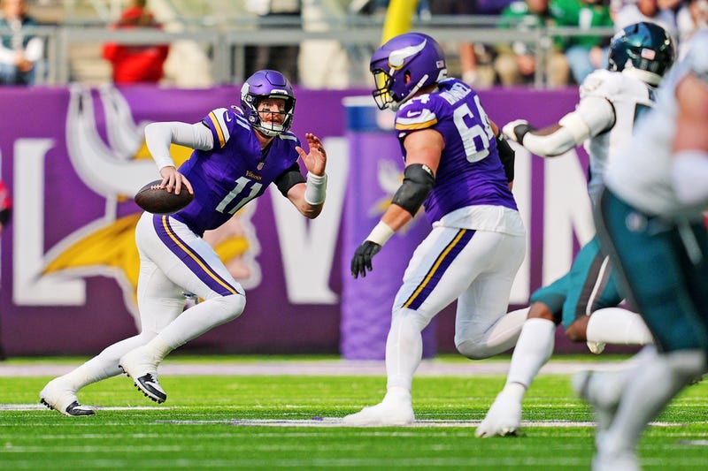 Minnesota Vikings quarterback Carson Wentz (11) runs the ball during the second half against the Philadelphia Eagles at U.S. Bank Stadium.