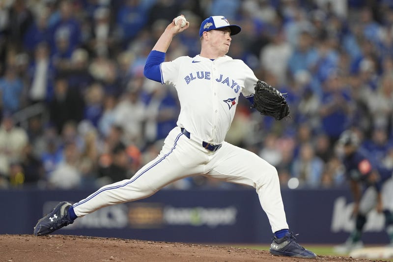 Toronto Blue Jays pitcher Louis Varland (77) pitches against the Seattle Mariners in the fourth inning during game seven of the ALCS round for the 2025 MLB playoffs at Rogers Centre.