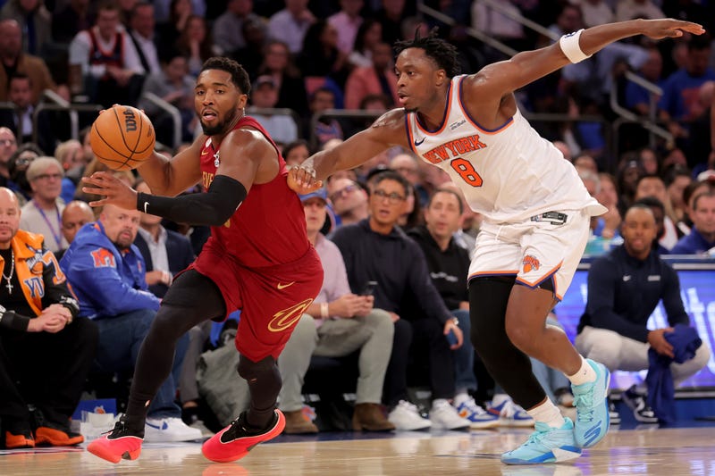 Oct 22, 2025; New York, New York, USA; Cleveland Cavaliers guard Donovan Mitchell (45) brings the ball up court against New York Knicks forward OG Anunoby (8) during the second quarter at Madison Square Garden.