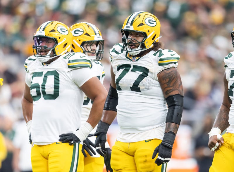 Oct 19, 2025; Glendale, Arizona, USA; Green Bay Packers offensive lineman Zach Tom (50) and guard Jordan Morgan (77) against the Arizona Cardinals at State Farm Stadium. Mandatory Credit: Mark J. Rebilas-Imagn Images
