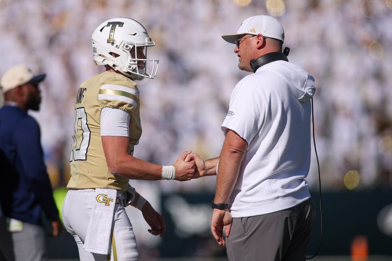 Georgia Tech Yellow Jackets quarterback Haynes King (10) and head coach Brent Key celebrate after at touchdown against the Syracuse Orange