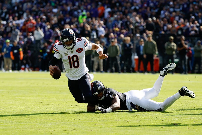 Bears quarterback Caleb Williams (18) is sacked by Baltimore Ravens linebacker Mike Green (45)