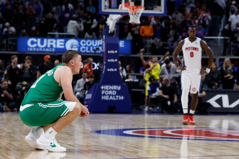 Boston Celtics guard Payton Pritchard (11) reacts in the second half against the Detroit Pistons at Little Caesars Arena.
