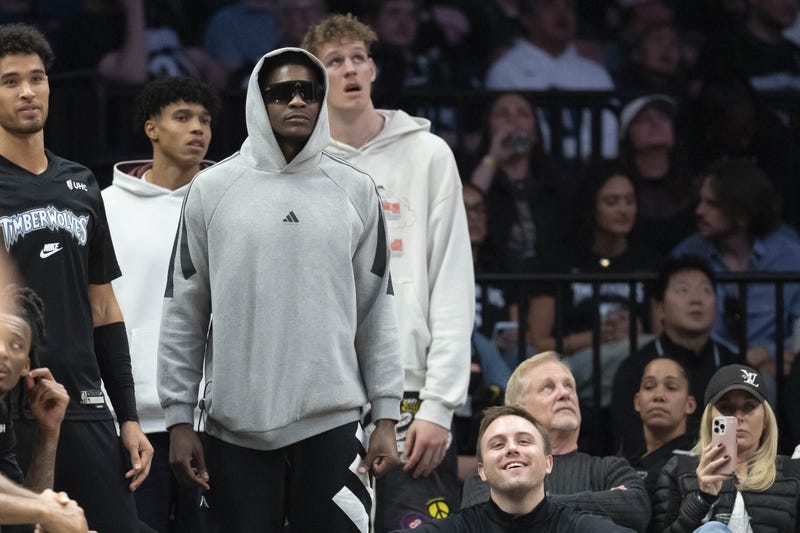 Minnesota Timberwolves guard Anthony Edwards (5) stands from the bench after injuring his hamstring in the first half against the Indiana Pacers in the at Target Center.
