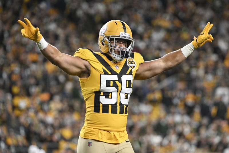 Alex Highsmith with arms out in alternate uniform