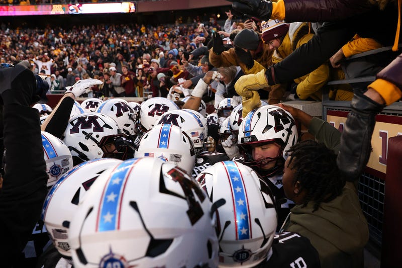 Minnesota Golden Gophers players celebrate Minnesota Golden Gophers quarterback Drake Lindsey’s game winning touchdown during overtime against the Michigan State Spartans at Huntington Bank Stadium.