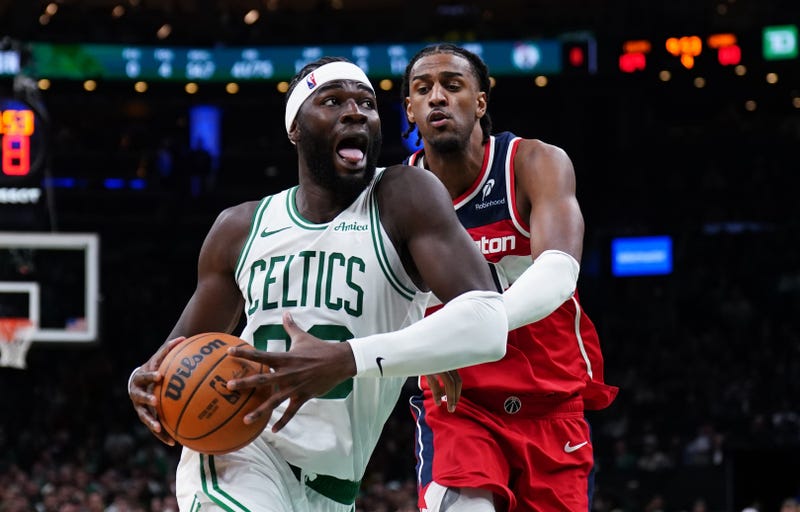 Boston Celtics center Neemias Queta (88) drives the ball against Washington Wizards center Alex Sarr (20) in the second half at TD Garden.
