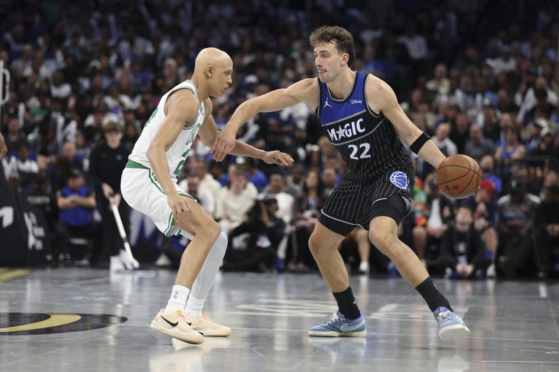 Orlando Magic forward Franz Wagner (22) is guarded by Boston Celtics guard Jordan Walsh (27) in the third quarter at Kia Center.