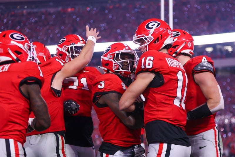 Georgia Bulldogs running back Nate Frazier (3) and wide receiver London Humphreys (16) celebrate scoring a touchdown in the second half against the Texas Longhorns at Sanford Stadium.