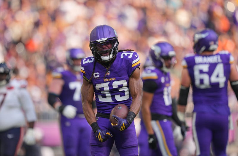 Minnesota Vikings running back Aaron Jones (33) reacts after a run for a gain during the first quarter against the Chicago Bears at U.S. Bank Stadium. 