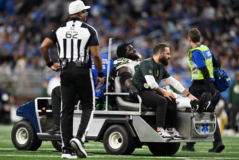 Nov 27, 2025; Detroit, Michigan, USA; Green Bay Packers defensive tackle Devonte Wyatt (95) is carted off the field after an injury against the Detroit Lions during the third quarter at Ford Field. Mandatory Credit: Lon Horwedel-Imagn Images