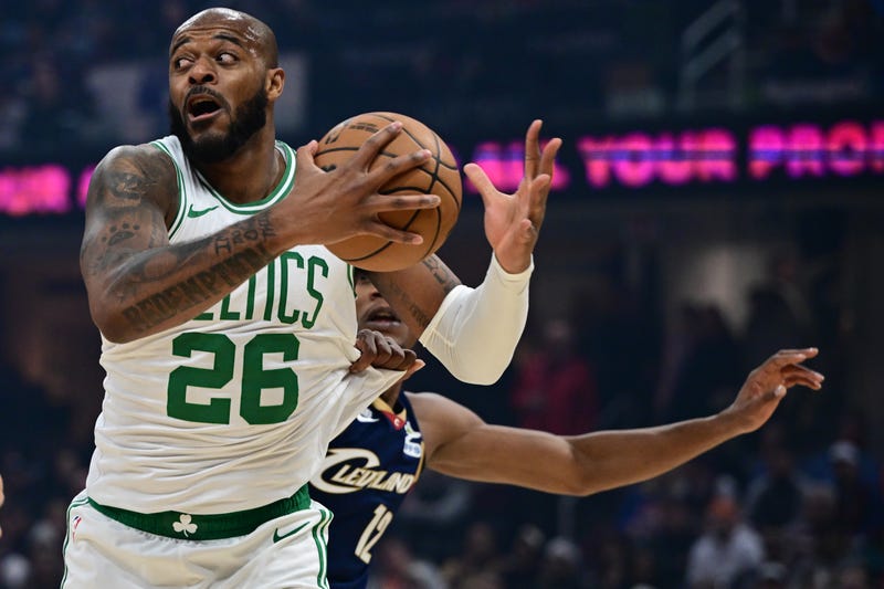  Boston Celtics forward Xavier Tillman (26) grabs a rebound away from Cleveland Cavaliers forward De'Andre Hunter (12) during the first half at Rocket Arena.