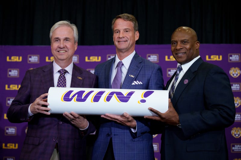 LSU president Wade Rousse, left, LSU new head coach Lane Kiffin and LSU athletic director Verge Ausberry