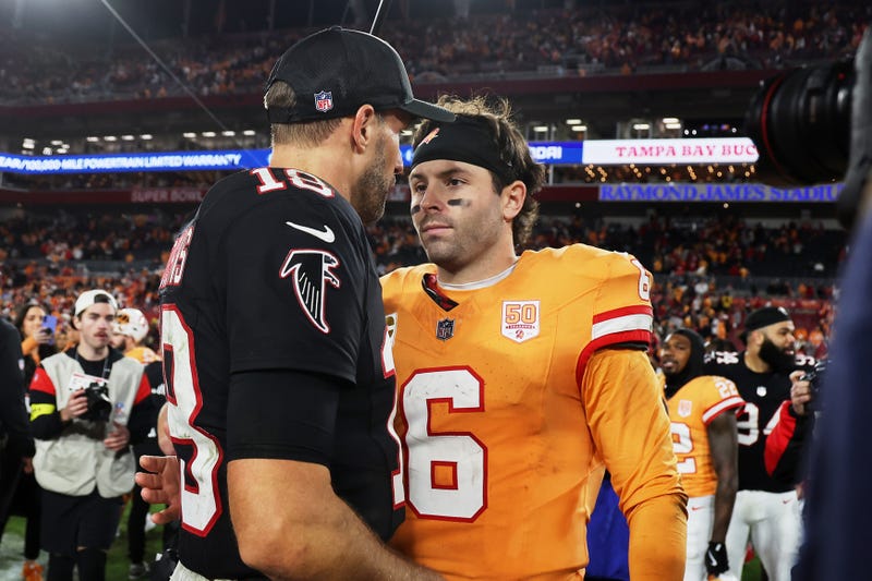 Dec 11, 2025; Tampa, Florida, USA; Atlanta Falcons quarterback Kirk Cousins (18) greets Tampa Bay Buccaneers quarterback Baker Mayfield (6) on the field after the game at Raymond James Stadium.