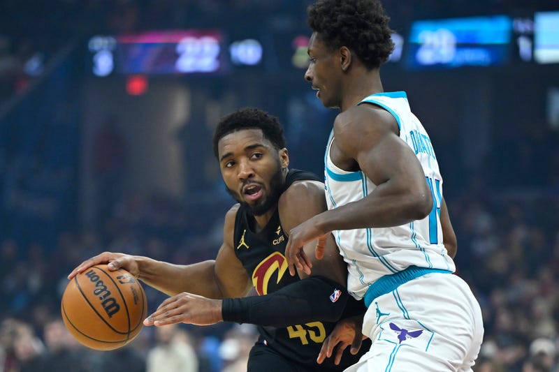 Cleveland Cavaliers guard Donovan Mitchell (45) dribbles beside Charlotte Hornets forward Moussa Diabate (14) in the first quarter at Rocket Arena
