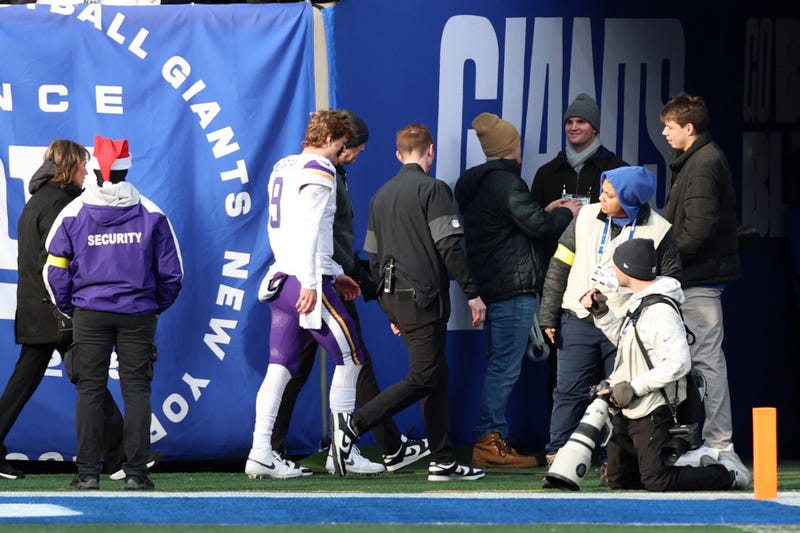Minnesota Vikings quarterback J.J. McCarthy (9) is taken to the locker room after a hit against the New York Giants during the first half at MetLife Stadium. 