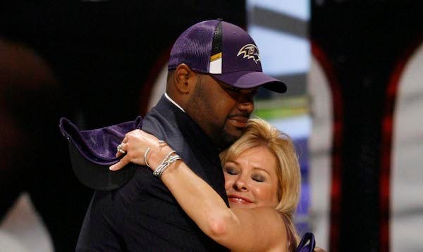 Michael Oher is hugged by Leigh Anne Tuohy during the 2009 NFL Draft at Radio City Music Hall.
