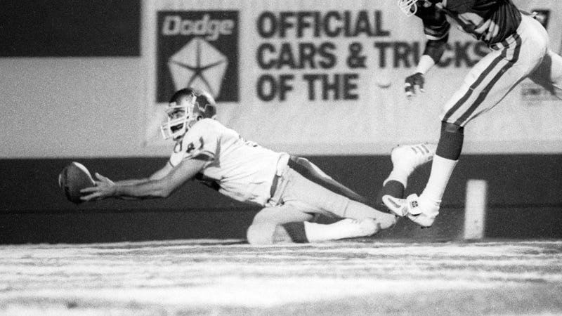Scott Fitzkee (81) of the Baltimore Stars, which were originally based in Philadelphia, catches a touchdown pass in front of Orlando Renegades defensive back Jeff George (43) at the Citrus Bowl during the 1985 USFL season.