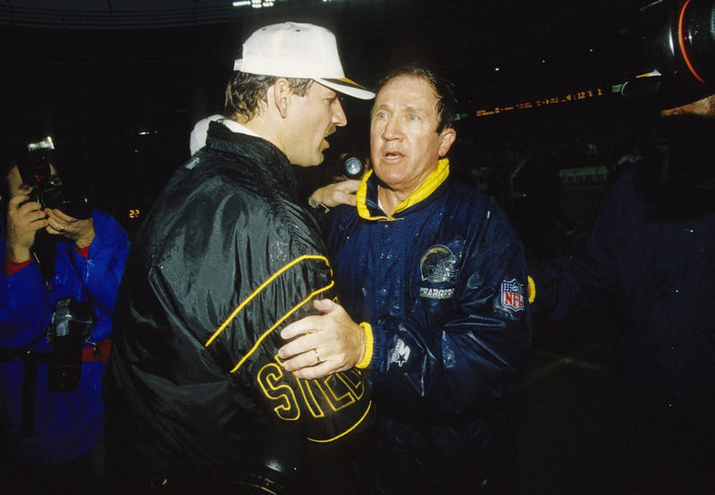 Pittsburgh Steelers head coach Bill Cowher (left) greets San Diego Chargers head coach Bobby Ross after 1994 AFC Championship Game at Three Rivers Stadium.