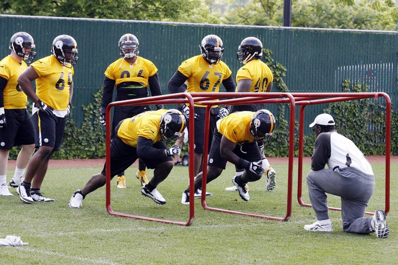 John Mitchell coaching D line in practice