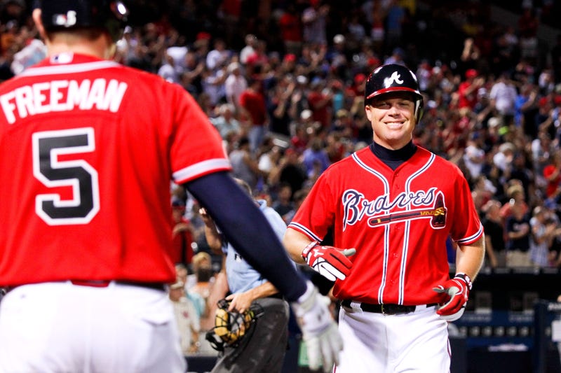 Atlanta Braves third baseman Chipper Jones (10) celebrates with first baseman Freddie Freeman (5)