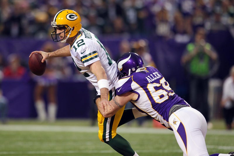 Minnesota Vikings defensive end Jared Allen (69) sacks Green Bay Packers quarterback Aaron Rodgers (12) at a game in the Metrodome in 2012.