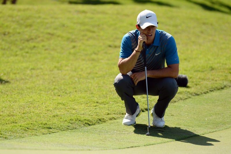 Rory McIlory lines up his putt on the 15th green during the first round of The Players Championship at TPC Sawgrass - Stadium Course.