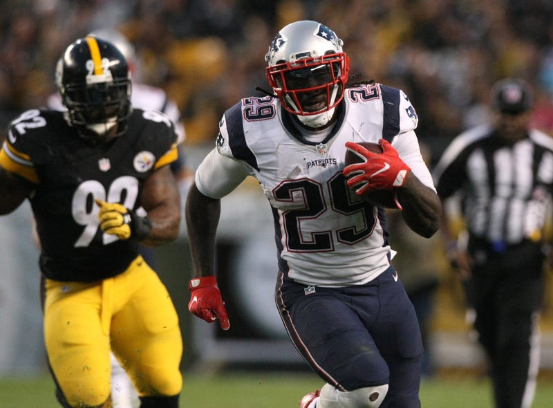 ; New England Patriots running back LeGarrette Blount (29) runs the ball past Pittsburgh Steelers linebacker James Harrison
