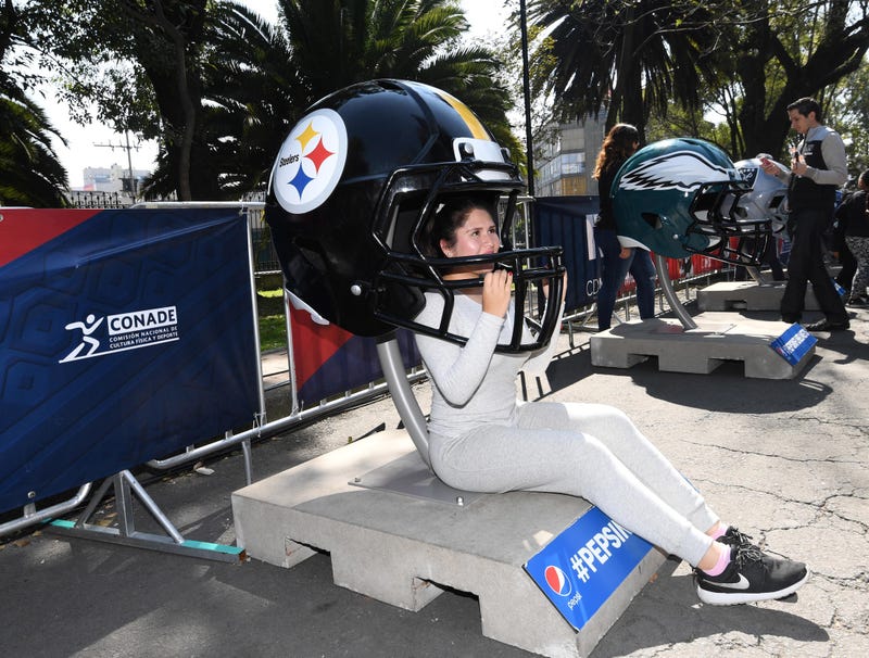  Mexico City, MEX; Female fan poses with replica Pittsburgh Steelers helmet during the NFL Fan Fest