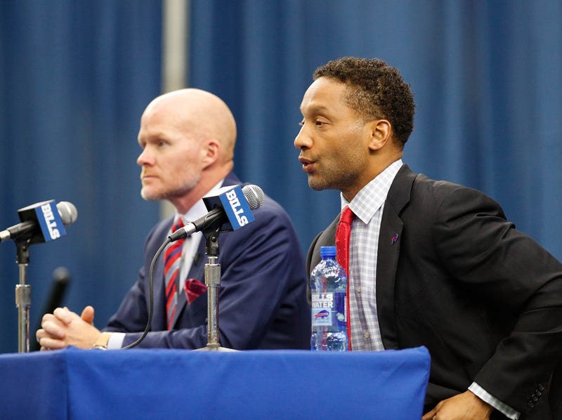 Buffalo Bills general manager Doug Whaley (right) speaks during a press conference 