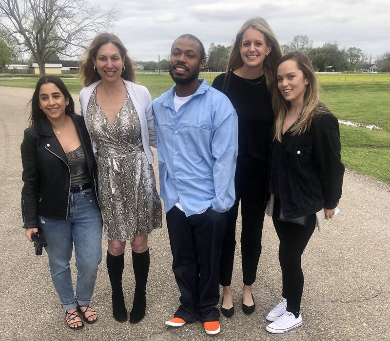 University of San Francisco students and law professor Lara Brazelon with former inmate Yutico Briley.