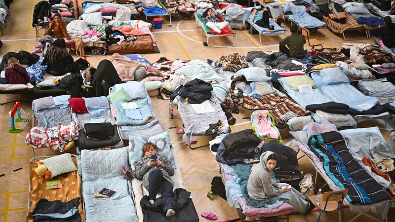Women and children who have fled war-torn Ukraine pass the time in a shelter set up in a primary school close to the Ukrainian border on March 21, 2022 in Przemysl Poland. 