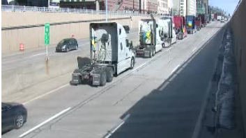Convoy of trucks, people with Ukrainian flags rally in downtown Detroit