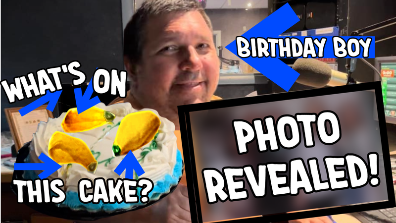 Johnny Lucas is pictured with arrows pointing at him, a birthday cake, and a blurred out photo. The text on the image says "Birthday Boy, What's on this cake?  and Photo Revealed"