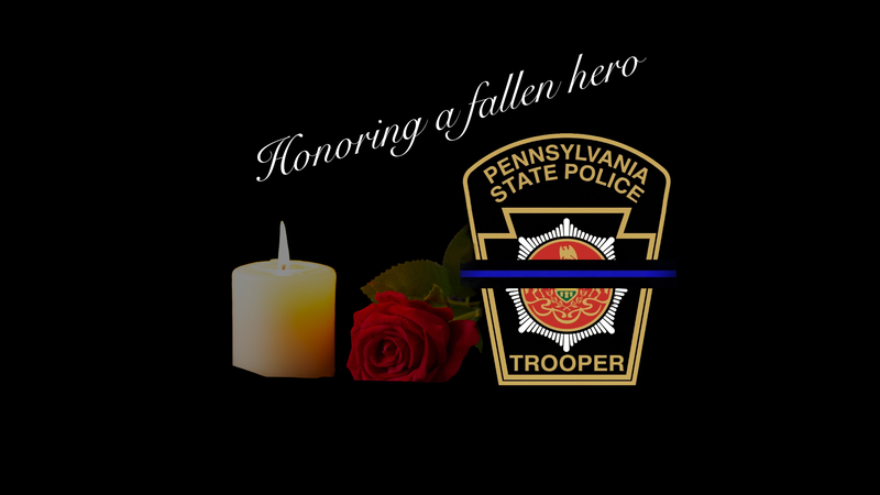 Honoring a Fallen Hero. A while candle and single red rose are shown as a sign of a respect following the death of a Pa State Trooper.  The Pa State Trooper logo is shown with the thin blue line across the logo, also as a way to honor the fallen trooper.