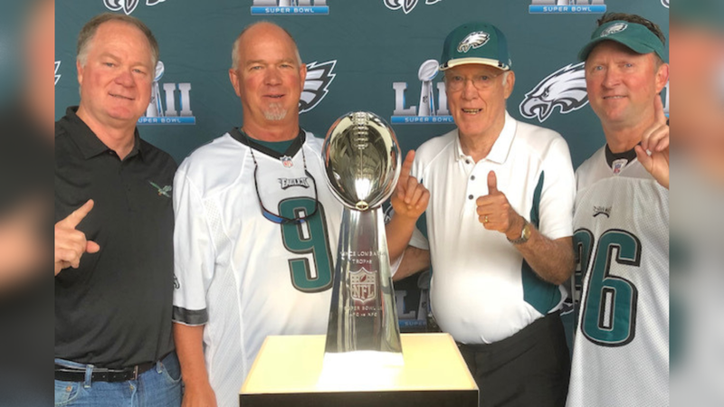Bill McCormick Jr. with the Super Bowl LII Lombardi Trophy, surrounded by family. 