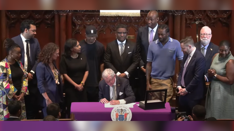 Gov. Phil Murphy signing clemency executive order on June 19, 2024.