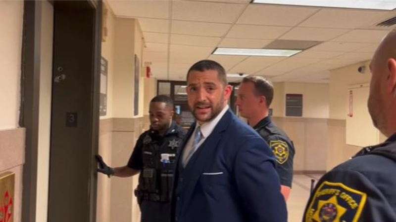 Francis Laurenzi being led from the courtroom in May 2024.