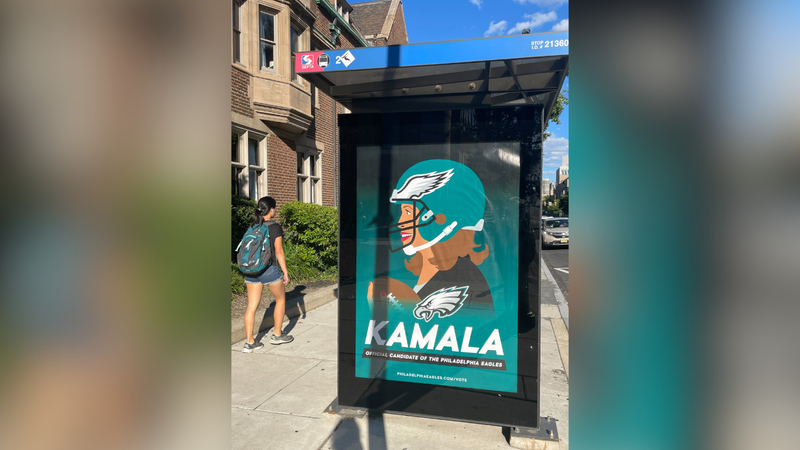 An ad declaring Vice President Kamala Harris as the "official candidate of the Philadelphia Eagles" at 18th and JFK