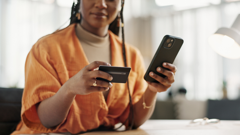 woman holding a credit card
