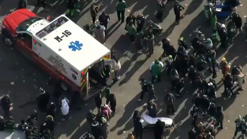 Eagles fans in the street surrounding an ambulance after a shooting during the Eagles Super Bowl parade on Friday, Feb. 14, 2025.
