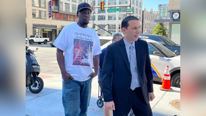 Lionell Dotson (left) walks into the Philadelphia Medical Examiner's Office on Aug. 3, 2022, to obtain the remains of his sisters: 1985 MOVE bombing victims Katricia and Zanetta Dotson.