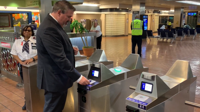 SEPTA  interim General Manager Scott Sauer demonstrates new contactless pay for Regional Rail