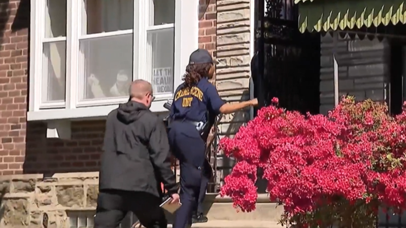 Criminal investigators enter home where 12-year-old was shot on Saturday, May 10, 2025.