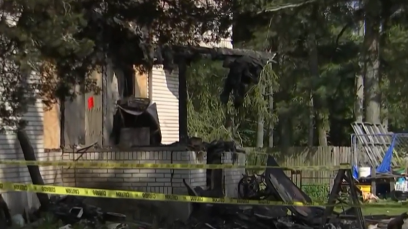 Caution tape surrounds house of NJ firefighter that burst into flames Thursday, May 29.